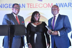 L-R, Former Governor of Ogun State, Otunba Gbenga Daniel with former Commissioner of Ogun State, Dr. Josephine Olatomi Soboyejo presenting the ‘Telecom CEO of The Year’ Award won by Airtel CEO, Segun Ogunsanya, to the Chief Operations Officer, Airtel, Mr. Tolu Ojo who represented the CEO at the Nigerian Telecom Awards 2014 held on Saturday in Lagos.